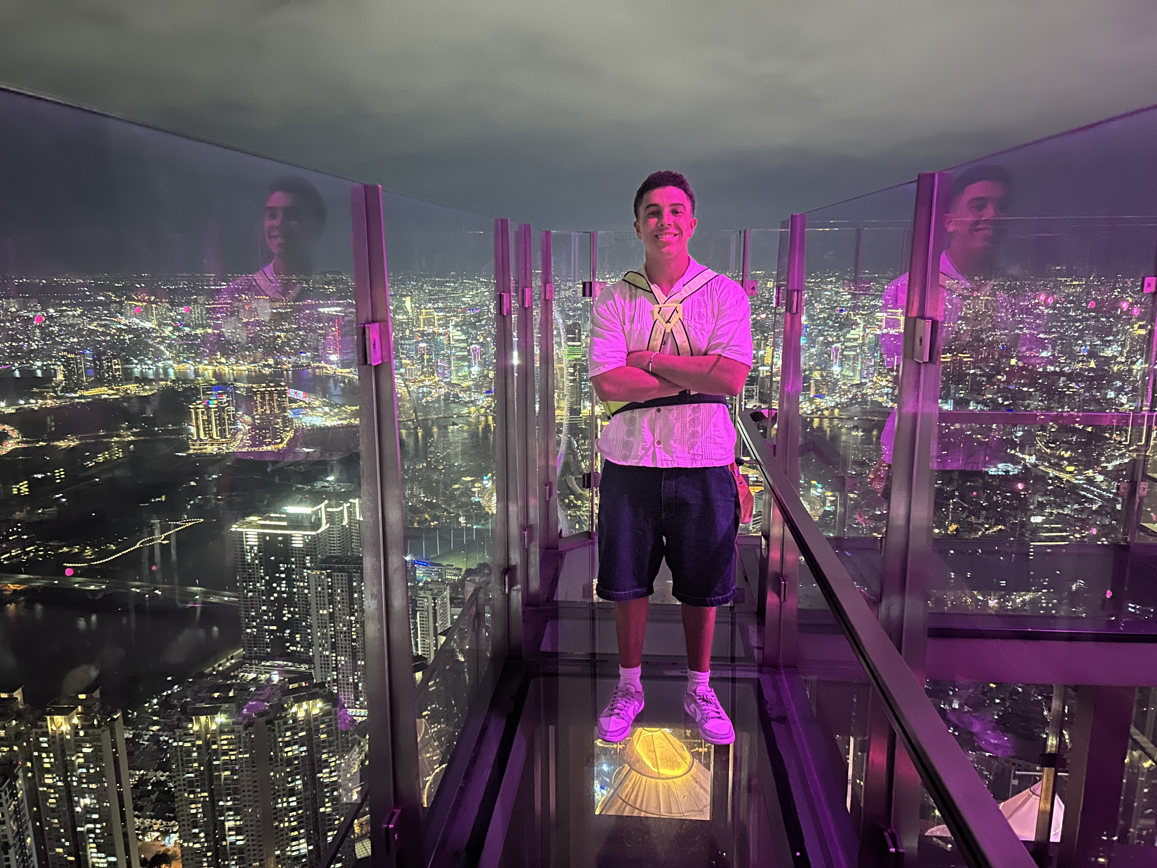 Team member on observation deck with city view